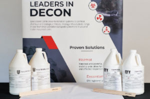 4 Bottles of EasyDecon Solution In front of a display