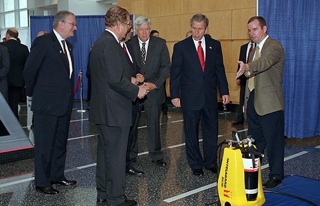 President Bush with 4 other Men Talking